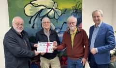 Wethouders met bestuursleden stichting de Mozaïek