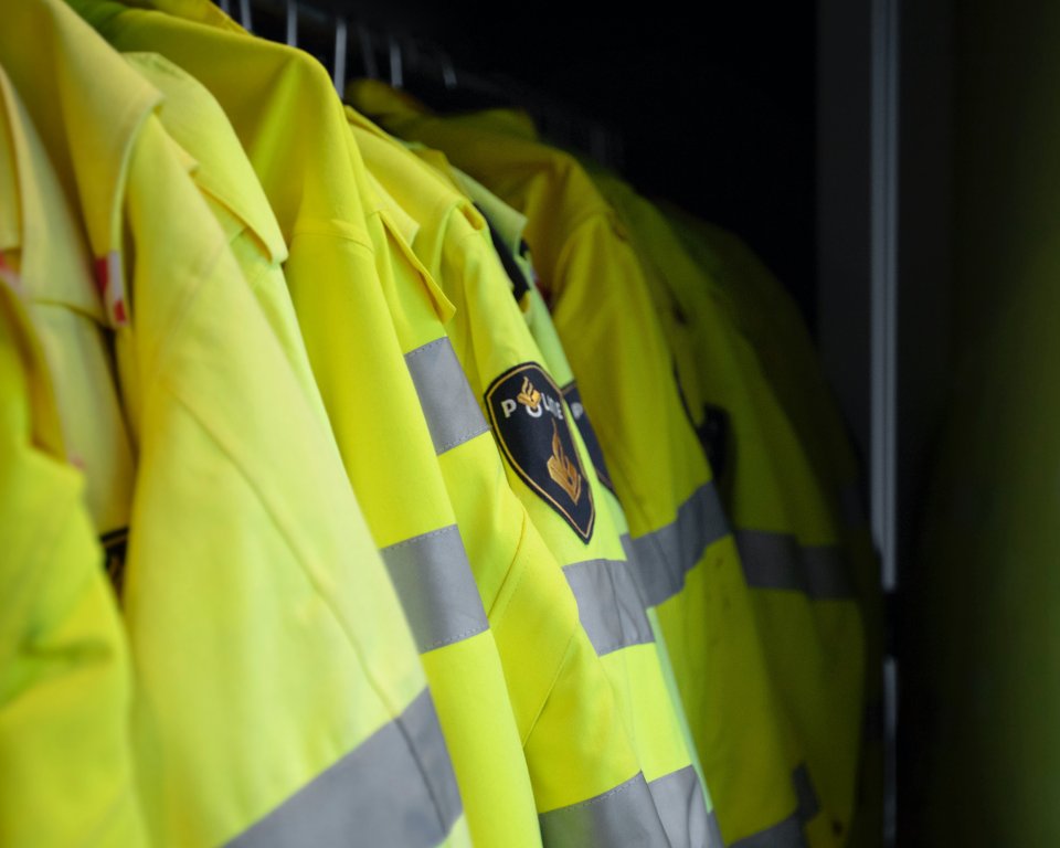 Photo of police jackets on a coat rack