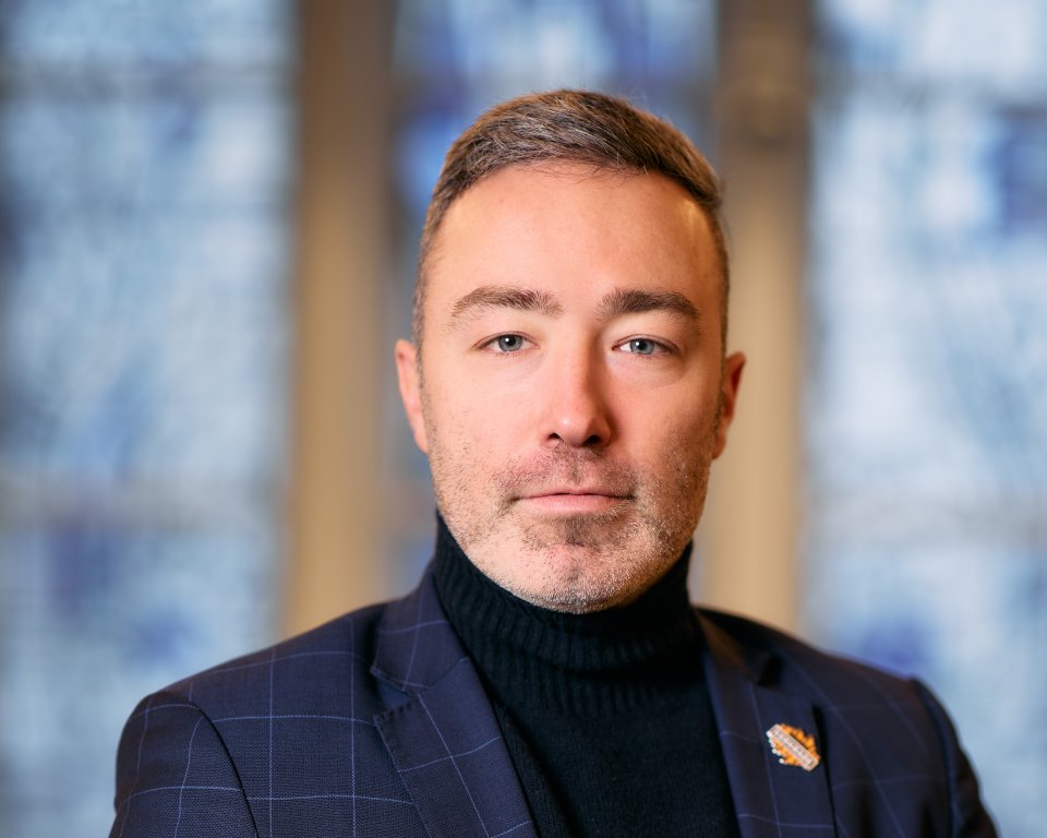 A portrait photograph of Alexander Geers