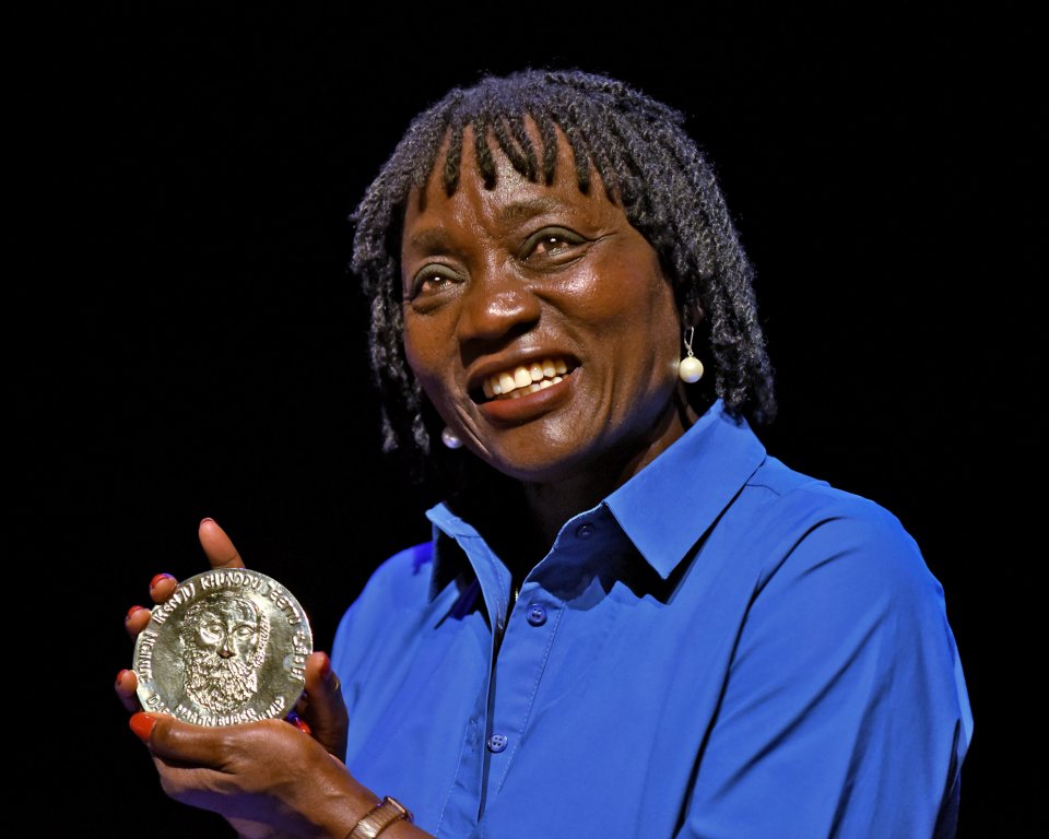 Auba Obama displays the Buber plaque