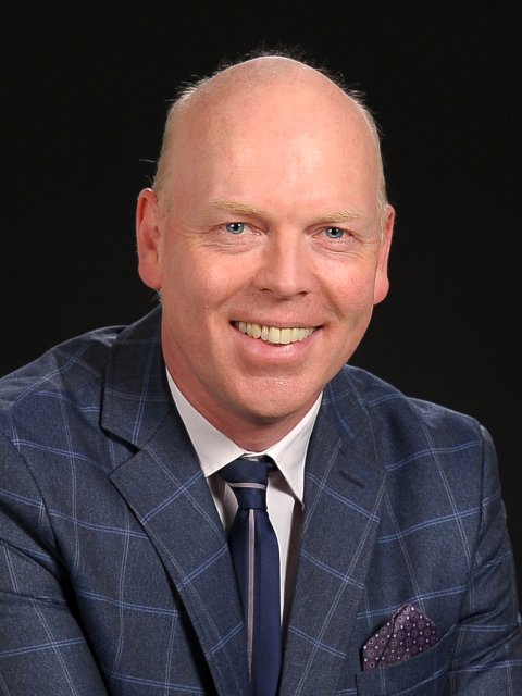 A portrait photo of wedding officiant Patrick Heckmanns