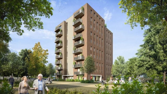 Ein Eindruck von den beiden Wohnhochhäusern: 9 Stockwerke mit Balkonen in einer grünen Umgebung.