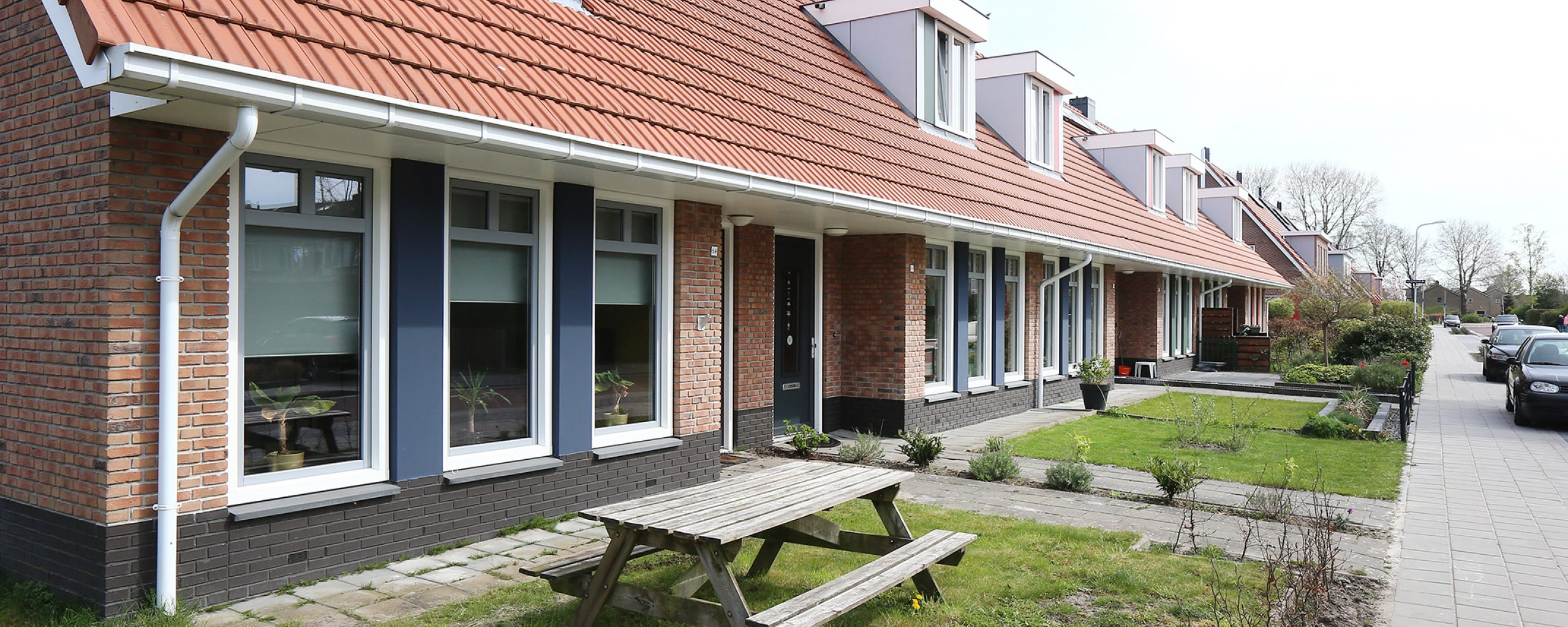Houses in a row in the street De Vlecke in Gorredijk