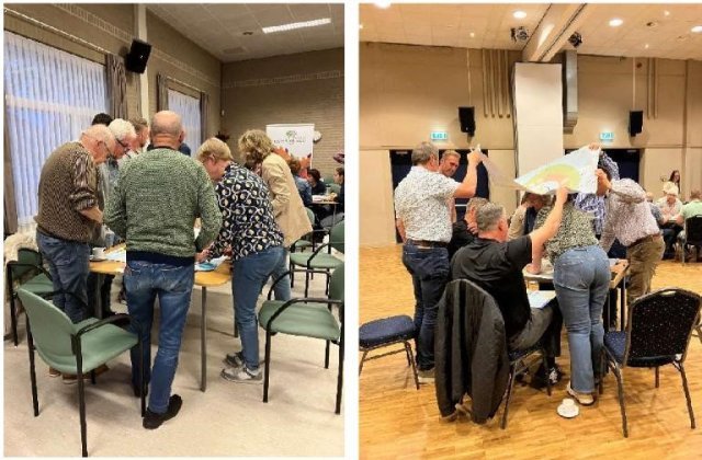 mensen staand aan tafel in workshopvorm