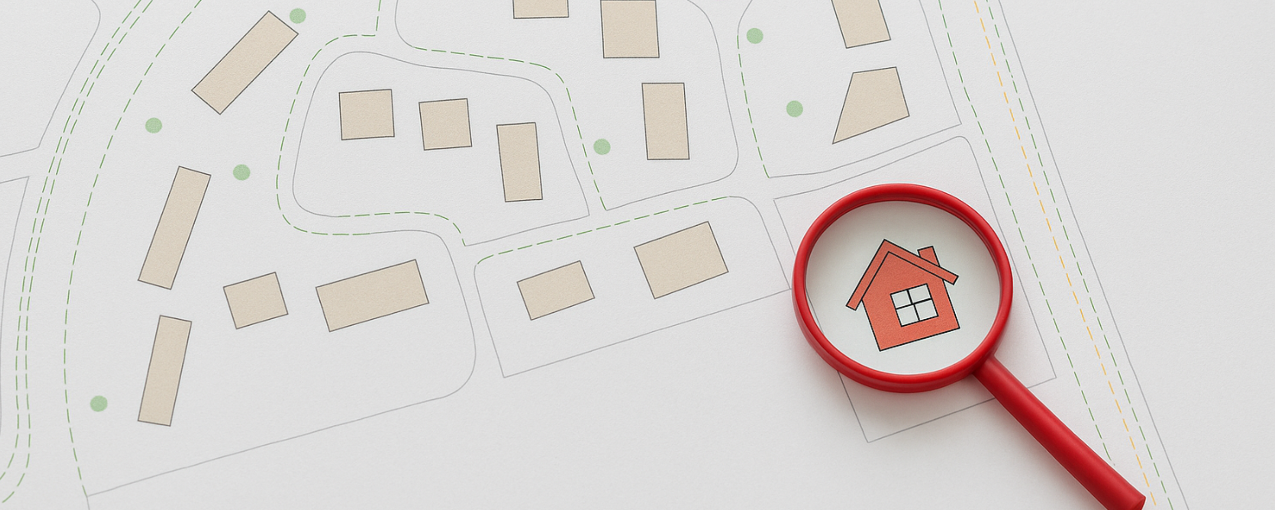 Een rood vergrootglas ligt op een kadastrale kaart. In het vergrootglas een rood huisje.