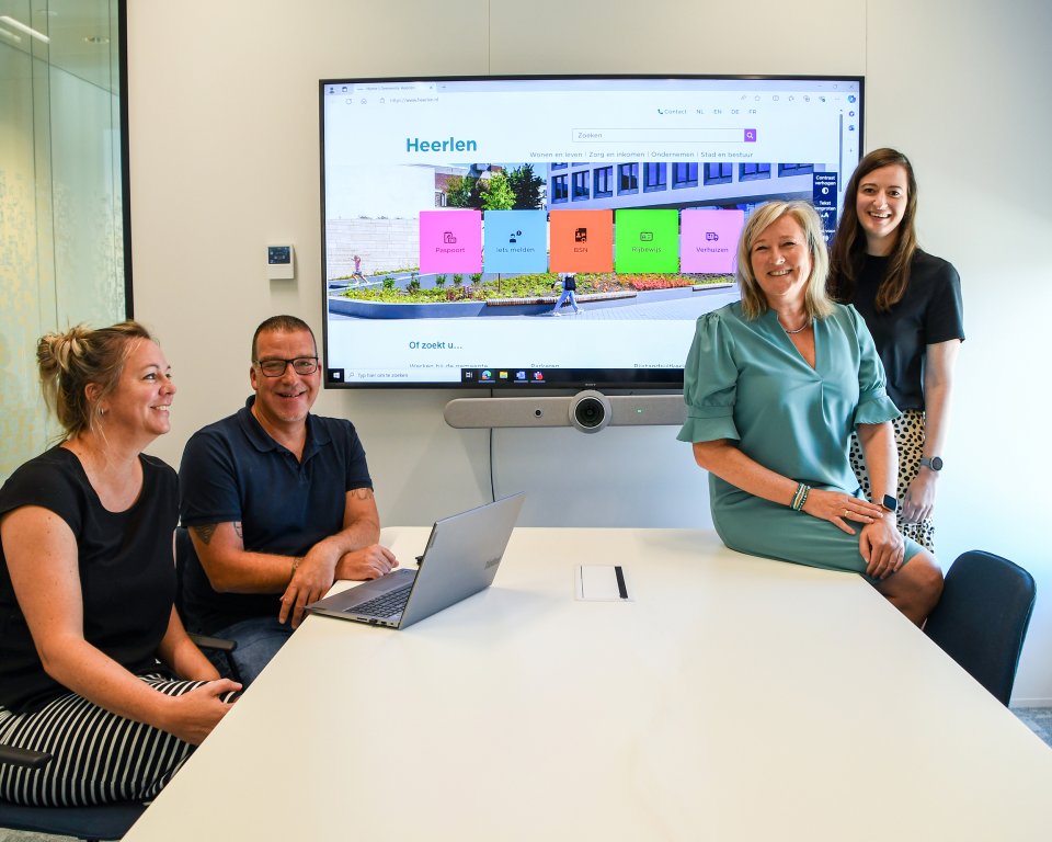 Website project group with the new website in the background