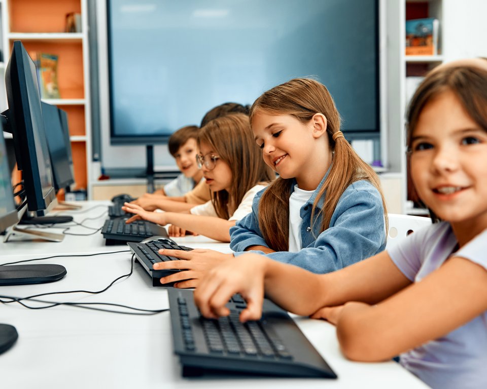 Children behind computer in classroom