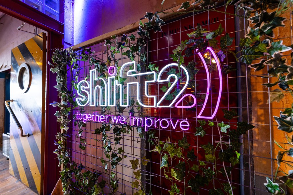 Wall with Shift2 the Future logo
