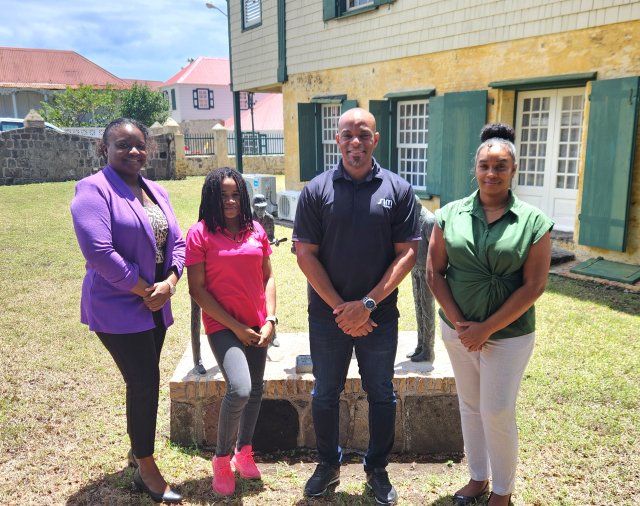 Representatives of the Island Council Registrar and SIM Caribbean
