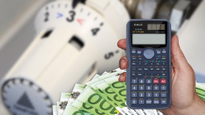 Calculator en geld en thermostaatknop