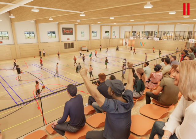 Binnenaanzicht van de sporthal Esrand met een grote sportvloer, verschillende sportende mensen en toeschouwers op de tribune die enthousiast juichen.