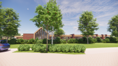 Het gebouw in een groene omgeving